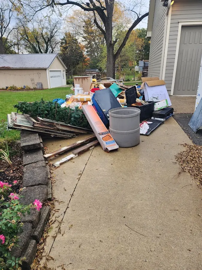 Dumpster being loaded with debris for Commercial Dumpster Rental in Cassville